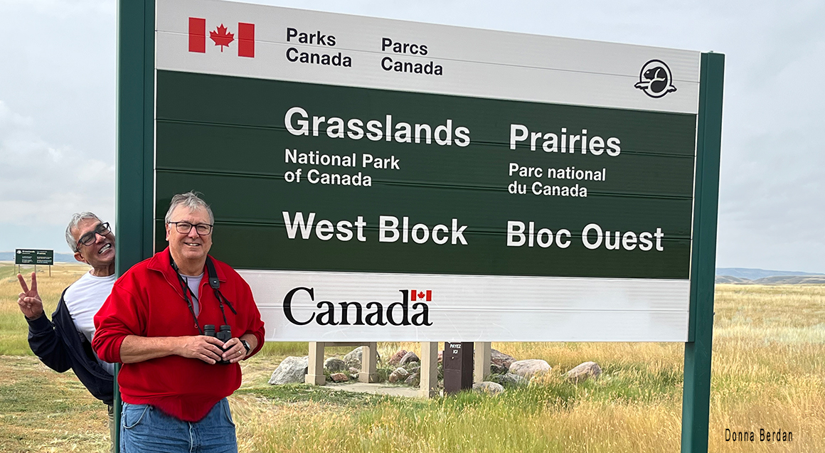 Kamal and Robert in front Grasslands National Park sign by Donna Berdan ©