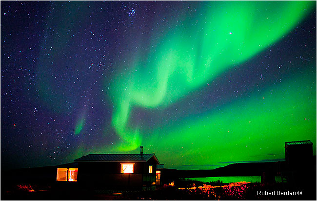 Aurora over cabins at Point Lake Lodge by Robert Berdan ©