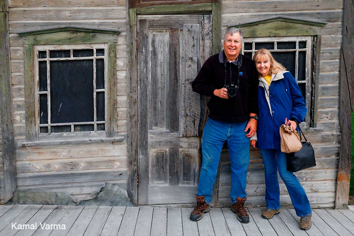 Robert and Donna in front of an original building  in Dawson city Yukon by Kamal Varma 