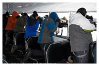 Photographers shooting out of tundra buggy by John Knight ©