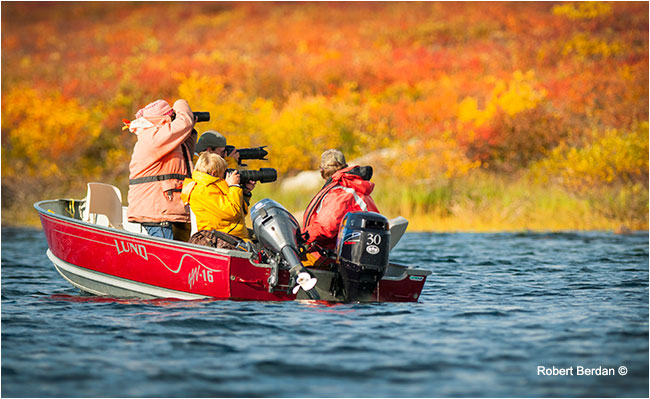 Photographers shooting from small boat on Point Lake by Robert Berdan ©