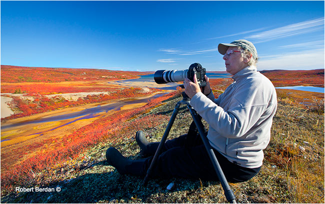 Photographer sits on top of Esker on the barrens by Robert Berdan ©