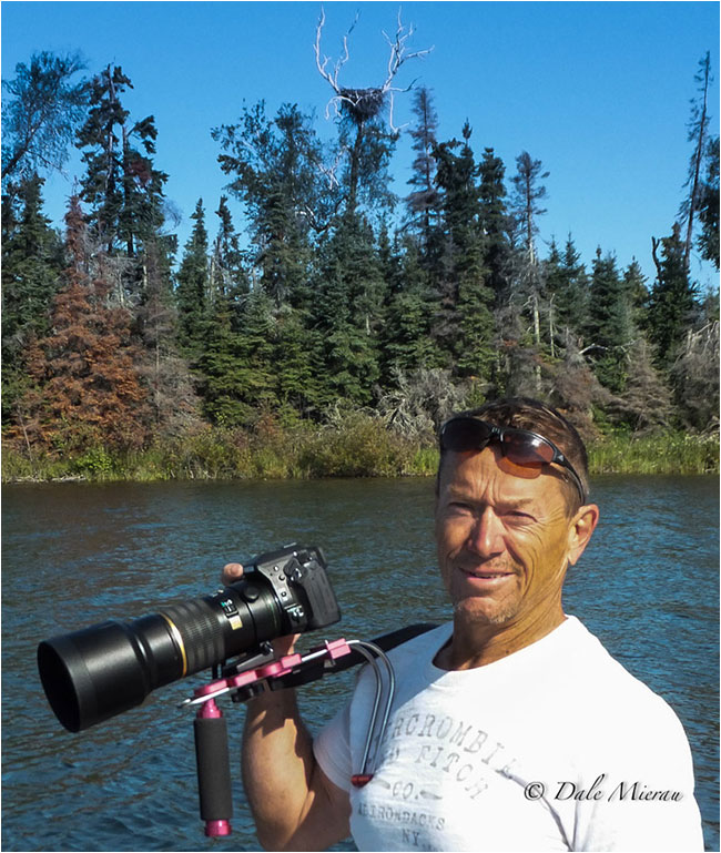 Dr. Dale Mierau with Camera and lens 
