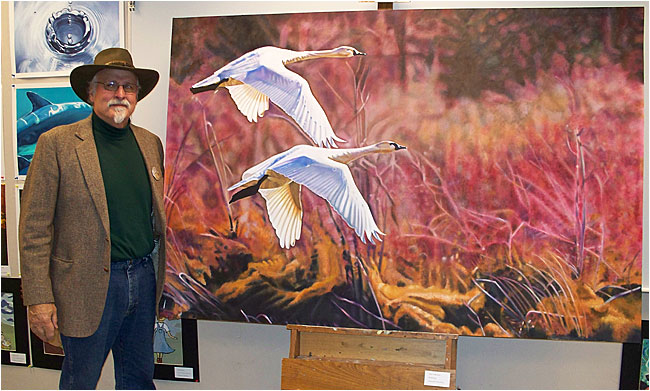 Dan Feldhauser in front of his painting of Tundra Swans ©