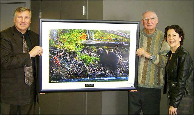 Frank Berdan, Karl Berdan with donated picture taken by Robert Berdan of Grizzly bear in Bellaz Coola. 