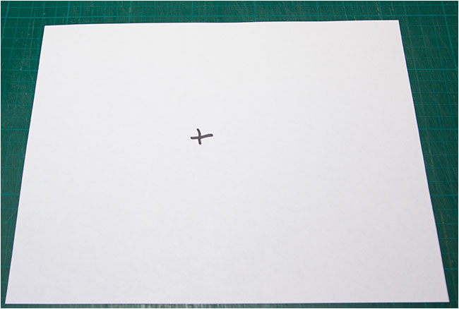 paper with a cross drawn on it for sensor cleaning by Robert Berdan 